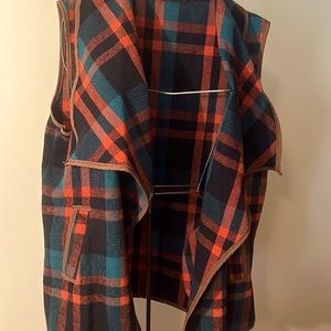 Vest-multi-colored: burnt red, teal, and black